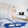 Mythic Suites and Villas master-bedroom-suite-junior
